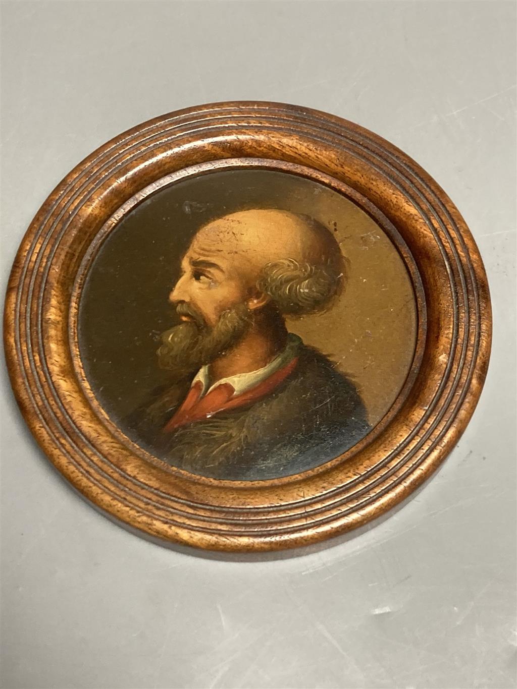 An Austrian papier mache portrait of a gentleman, in turned frame, early 19th century, a similar box of a classical scene and a seed pe